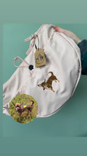Load image into Gallery viewer, a pink cross body bag with a brown chihuahua embroidered on it with the photo of the brown chihuahua next to it